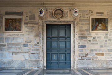 Entrance door to the Basilica di Santa Maria in Trastevere, romanesque styled church in Trastevere, Rome	