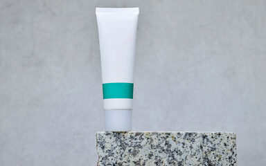 Cream product above marble podium or stone beauty. Cosmetic product branding mockup. Daily skincare and body care routine