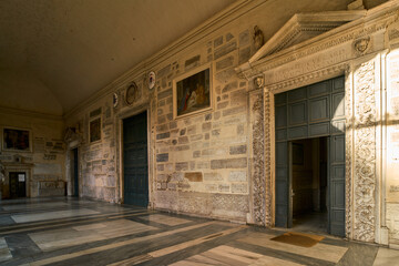 Entrance door to the Basilica di Santa Maria in Trastevere, romanesque styled church in Trastevere, Rome	