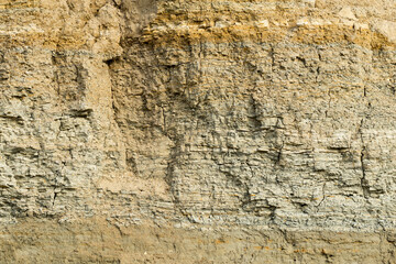 Sedimentary rocks with a high content of iron oxide. Red soil, loam. The texture of the soil.