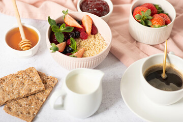 Healthy breakfast ingredients. Homemade granola in open glass jar, milk or yogurt bottle