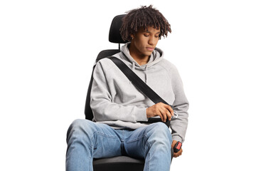 African american young man in a car seat buckling a seatbelt