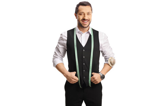 Young male tailor with a measuring tape smiling at camera