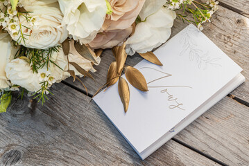 The Bride's Wedding Vow Book Next To Bouquet