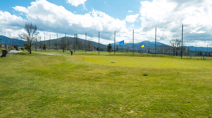 Man playing golf on the camp in Spain.