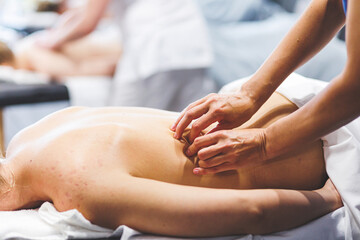 Obraz na płótnie Canvas Natural massage for beautiful woman. Concept of body self care. Professional Spa massage