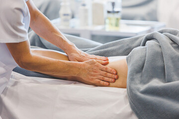 Professional calf and leg massage by massage therapist. Spa well being self care of body concept