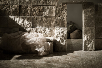 Empty tomb while light shines from the outside. Jesus Christ Resurrection. Christian Easter concept.