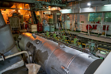 Ship's engine room. Vessel's ( Ship ) Engine Room Space / industrial stairs. Ship's Engine Heavy Machinery Space - Pipes, Valves, Engines
