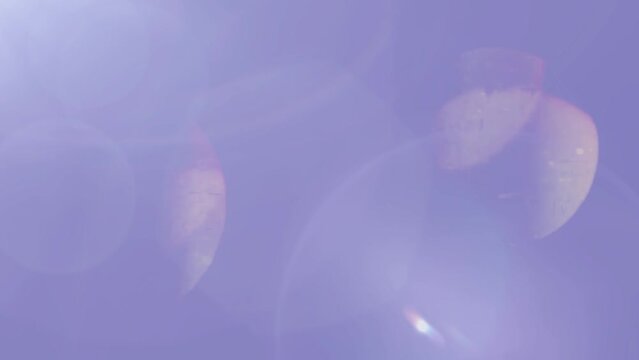 Light leaks, lens flare and bokeh abstract background on  lavender.