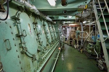 Ship's engine room. Vessel's ( Ship ) Engine Room Space / industrial stairs. Ship's Engine Heavy Machinery Space - Pipes, Valves, Engines