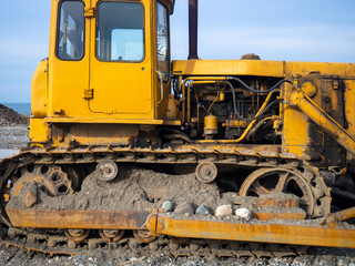 Bulldozer for excavation. B10PM. Tractor from the Chelyabinsk Tractor Plant. Part of an orange tractor.