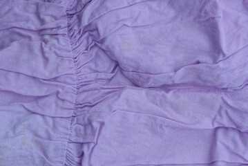lilac fabric texture of crumpled piece of matter in the cloth
