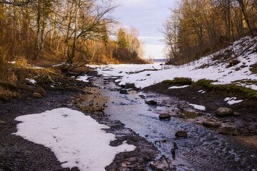 a stream flowing into the Daugava River in the town of Aizkraukle in early spring5