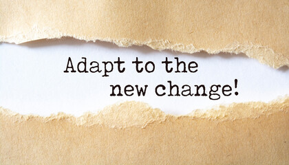 Adapt to the new change. Words written under torn paper.