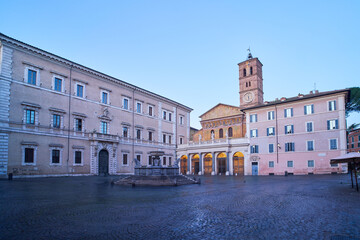 Fototapeta na wymiar Piazza di Santa Maria in Trastevere, early morning in a square at the heat of Rome, Italy