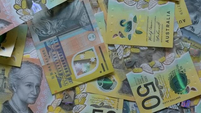 Australian money falling, fifty dollar notes, slow motion closeup