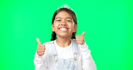 Portrait, children and thumbs up with a girl on a green screen background in studio wearing a princess tiara. Kids, thank you and emoji with an adorable little girl child saying yes in agreement - Powered by Adobe