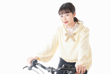 Fototapeta na wymiar 自転車を運転する若い女性