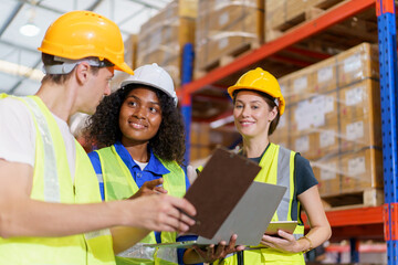 Happy Asian senior supervisor working - inspecting an items in the warehouse, smart and good looking handsome Asian man portrait while working in the warehouse. Warehouse worker working.