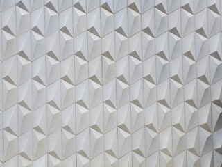 Wall texture of the outside of a house. Made of ceramics in high relief forming geometric shapes,...