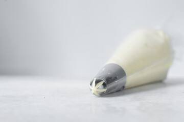 Buttercream in a piping bag, American buttercream in a piping bag for icing cake, frosting for decorating cake