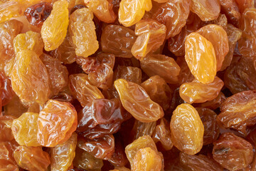 pile of prunes, european golden yellow color dried plums, close-up of popular snack and ingredient in many cuisines, full frame food background