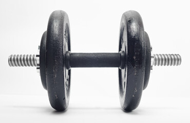 detachable metal dumbbell, white background, black discs, metal barbell, exercise and health issues