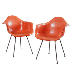 Pair of moulded fiberglass red-orange mid-century modern chairs. No background. 