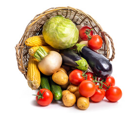 Overturned basket with vegetables Isolate on white background