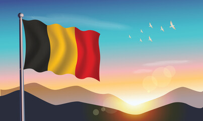 Belgium flag with mountains and morning sun in background