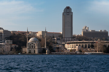 European part of Istanbul in the Besiktas area and the Sultan Bezmialem Valide Mosque (Dolmabahce Mosque) from the Bosphorus, Istanbul, Turkey