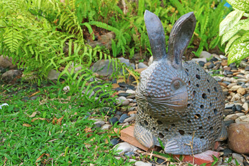 Artistic Easter Bunny Stone Figurine in the Garden