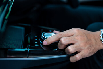 Men's hand crank controls the electric car driver shifting gears electric car's gear.