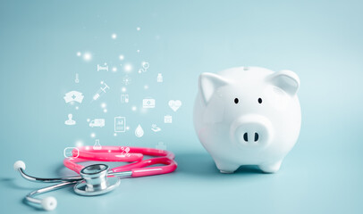 Piggy bank with stethoscope. saving money to health check insurance concept. Health care financial checkup and saving for medical insurance cost planning in the future.