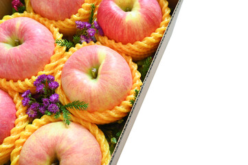 beautiful pink apple in the box on white background