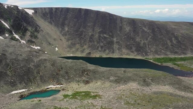 Aerial video of mount Sarlyk cirque with glacial lakes in Altai.