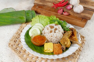 Nasi Tutug Oncom. Traditional Sundanese meal of rice mixed with fermented soybean; accompanied with...