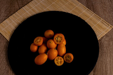 close-up of small Chinese oranges or Kumquat (Citrus sinensis)