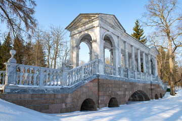 At the ancient Marble Bridge on a sunny February day. Catherine Park in Tsarskoye Selo. Suburbs of...