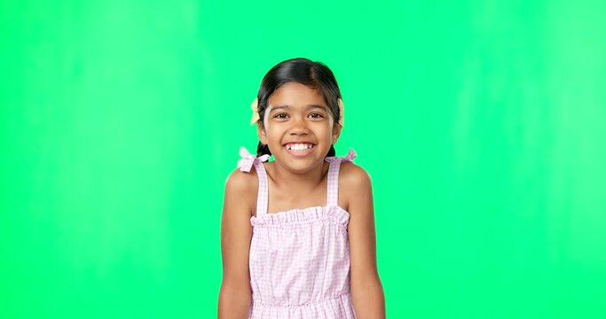 Portrait, happy and a girl shrugging on a green screen background in studio to gesture doubt or whatever. Smile, question and confused with an adorable little female child on chromakey mockup
