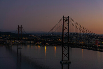 Fototapeta na wymiar Red Bridge April 25th in Lisbon at down