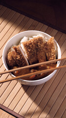 Bowl of curry with chopsticks