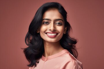 Fototapeta premium Portrait of a smiling beautiful female of Indian ethnicity. Created using Generative AI