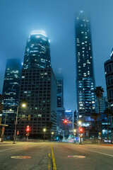 Fototapeta na wymiar Downtown city buildings foggy night