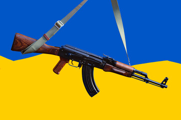 Kalashnikov gun against colors of Ukrainian flag