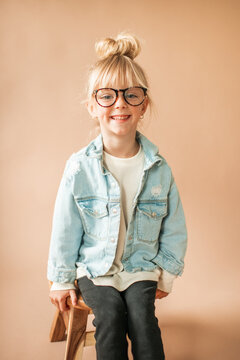 Happy Portrait of Cute Little Toddler Girl with Glasses Smiling