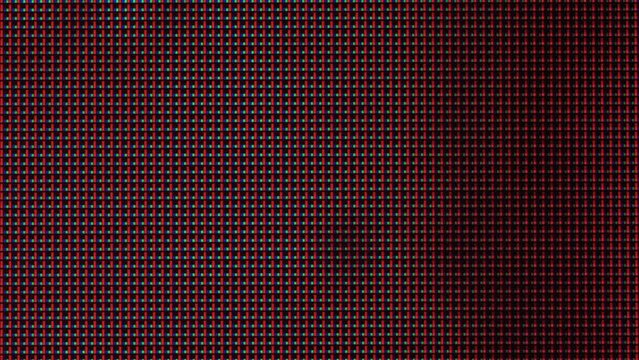 Close-up of the LCD screen pixels. Macro view of a television LED screen. Colored RGB sub-pixels create an abstract pattern. Red, blue, and green LED pixels of the VA matrix of 4K TV. Colorful display