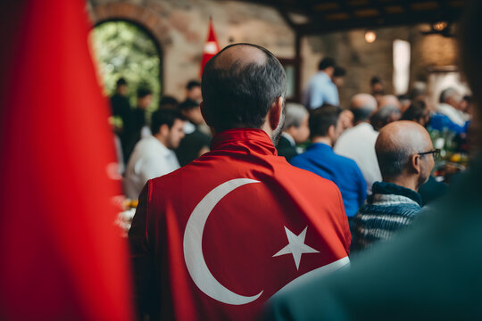 Crowd of people walk through the streets of a Turkish city with the national flag. Generative AI