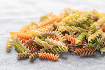 A variety of fusilli pasta made from different types of legumes, green and red lentils, mung beans...